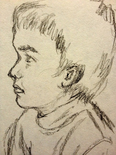 Charcoal sketch of a young boy age five.